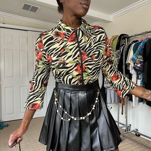 zebra print/floral zip up blouse. Fits like a medium. No flaws.
